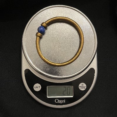 The replica Amenemope bracelet displayed on a digital scale documenting its 20-gram weight.