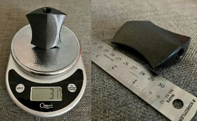Replica displayed alongside a scale and ruler documenting its 31-gram weight and 7.5-centimeter length.