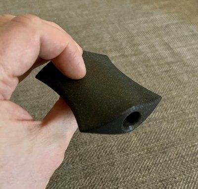 Profile view of the replica emphasizing the central longitudinal drilling axis used for mounting.