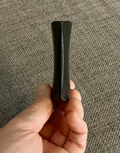 Narrow edge profile demonstrating the precise thinness of the hard composite plastic replica.