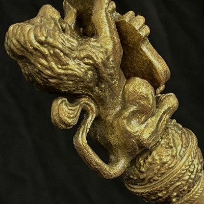 Extreme close-up of the lion holding a shield with King Edward VII's cypher.