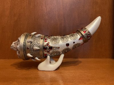 Angled full view of the Horn of Dagoth replica highlighting the jeweled banding and texture.
