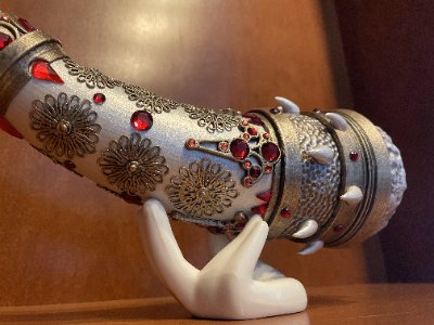 Detailed view of the replica horn midsection focusing on varied rhinestone cuts and metalwork.
