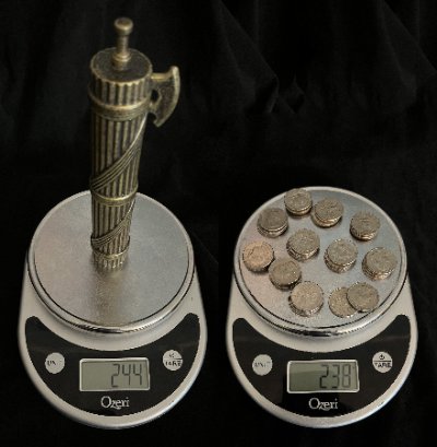 Fasces on a digital scale displaying 244 grams beside an equivalent weight in coins.