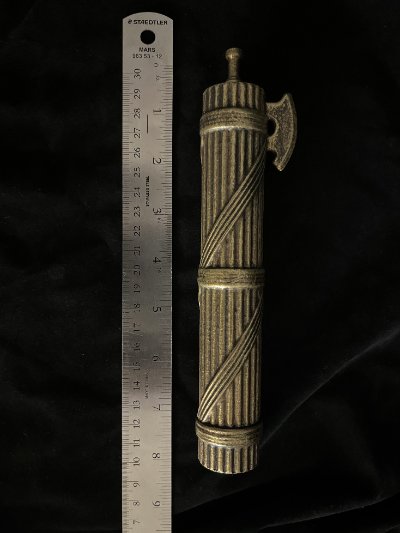The fasces replica positioned next to a standard ruler measuring nearly eight inches.