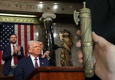 Composite showing the U.S. House rostrum beside a hand holding the replica.