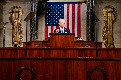 U.S. House of Representatives rostrum featuring the architectural fasces on the wall.
