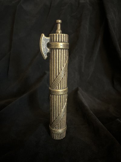 Angled full view displaying the side profile of the axe head and bound rods.