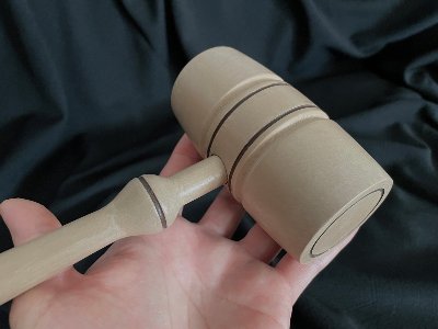 Close-up of the replica gavel head detailing the auburn stained groove pattern