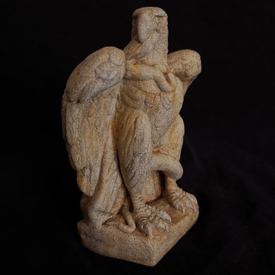 Angled three-quarter front view of the standing Roman eagle and snake replica sculpture.
