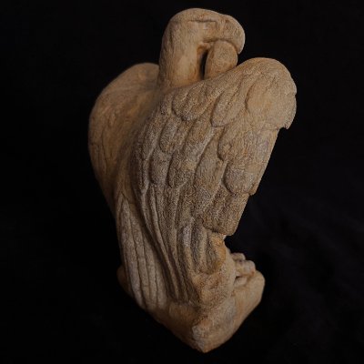 Full rear view of the replica sculpture, displaying the feather details on the back and wings.
