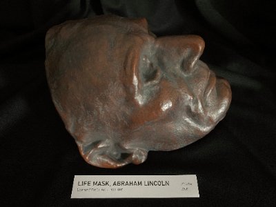 Low angle right profile view emphasizing the chin and facial contours of the mask.
