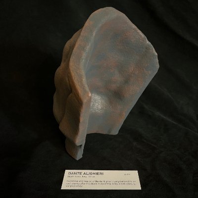 Angled posterior view of the inner cavity resting on a dark archival background.
