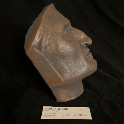 Complete left lateral profile of the reconstituted limestone and bronze effigy.