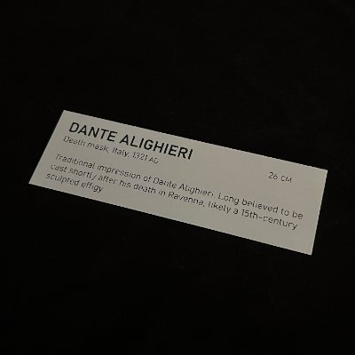 Close-up of the accompanying museum-grade display tag detailing historical context.