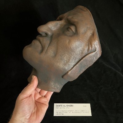Archival handler supporting the mask to display its left profile scale and details.