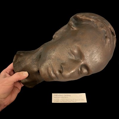 High angle view of the face pointing upwards while being held by a hand.
