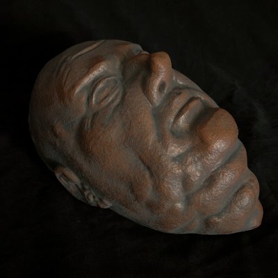 Three-quarter left profile of the effigy resting on a dark background.