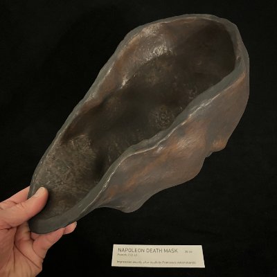 View into the hollow interior of the reconstituted limestone death mask held in hand.