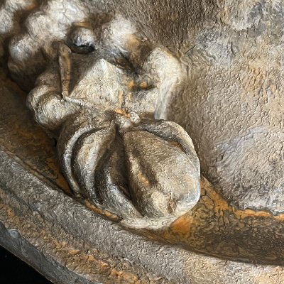 Detail view of the ornate decorative element on the right side of the hair.