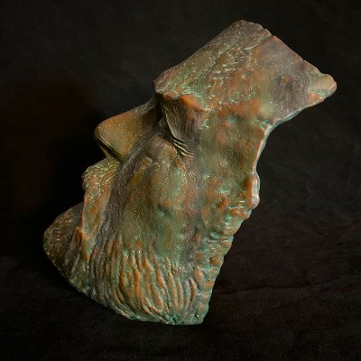 Left profile view displaying the jagged, torch-severed perimeter of the replica.