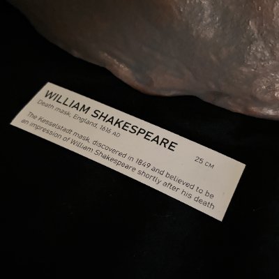 Close-up of the printed museum display tag for the William Shakespeare mask.