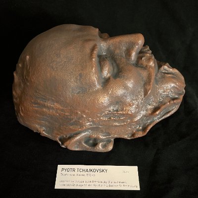 Right profile of the 1893 Pyotr Ilyich Tchaikovsky death mask replica with display tag.