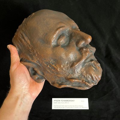Left profile of the Tchaikovsky replica held upright by hand to demonstrate its life-size scale.
