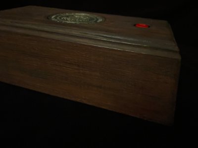 Side profile view of the wooden call box replica, showing its height and construction.