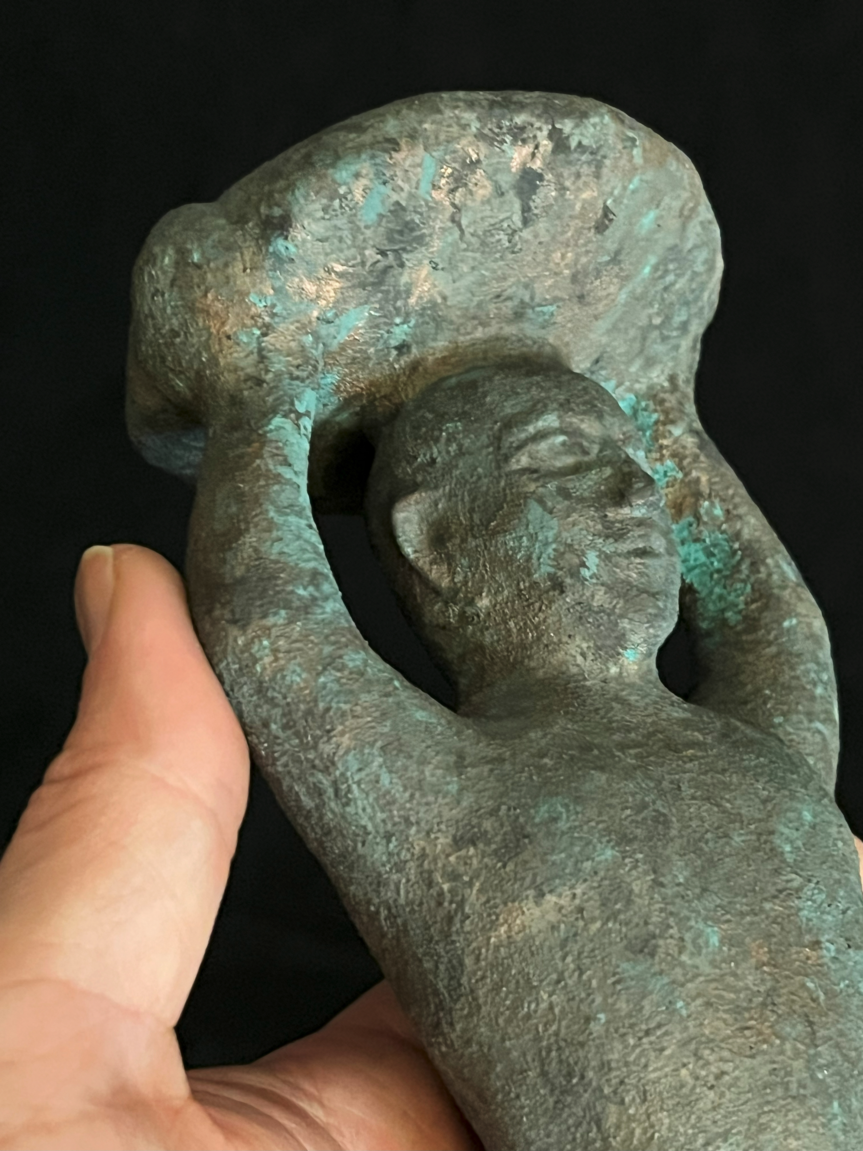 Close-up of the replica Sumerian foundation peg upper torso held in hand.