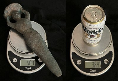 Side-by-side weight comparison of the 484-gram replica on a digital scale.