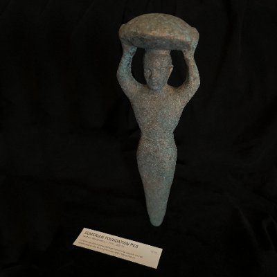 Direct frontal view of the standing Sumerian foundation peg replica.