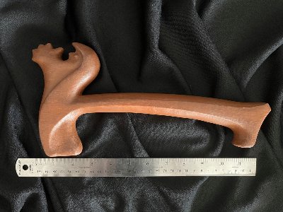 The 30-centimeter replica wooden gavel displayed horizontally above a standard metal ruler.
