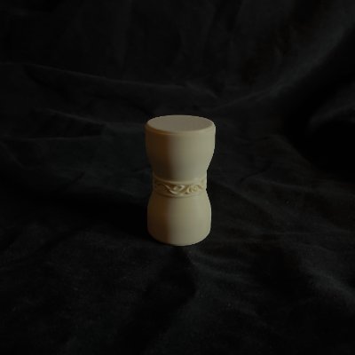 A wide view displays the U.S. Senate replica gavel standing upright against a dark studio backdrop.