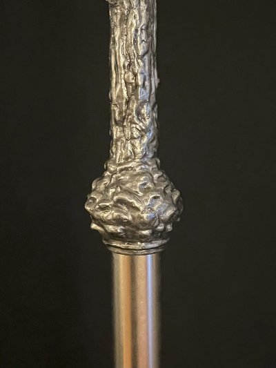 Detail of the textured nodus at the base of the crucifix where it joins the carrying staff.