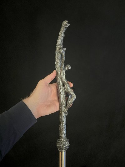 Side profile of the papal crucifix replica demonstrating the forward curvature of the cross.