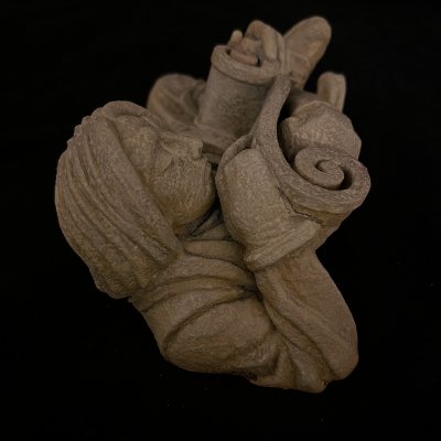 High-angle perspective showing the depth and curvature of the scholar figure replica.